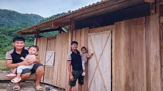 Kien and his young daughter make doors and windows for the new wooden house. Ordinary life