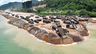 Huge Land Reclamation Process Dump Truck Management Unloading Rock Dirt Bulldozer Pushing Stone