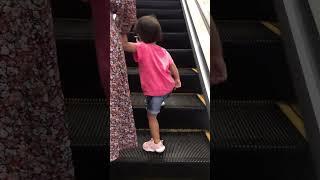 Selena likes dad to take escalator together.