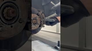 Using a C-clamp to decompress the brake piston on a Toyota Corolla brake job #brakepads #diy