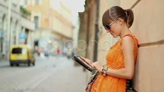 Happy Attractive Woman With Tablet Computer In The City, Steadicam Shot. Stock Footage