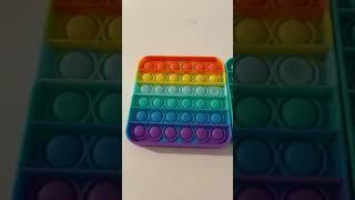 Comparing the rainbow pop it and the teal blue pop it. I recommend the teal blue.