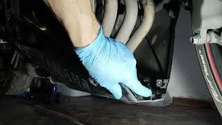 Muffler flange repair on a motorcycle.