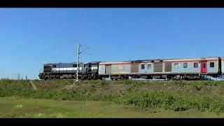 15960 Kamrup Express traversing through lush greenry near Basugaon, Assam