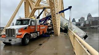 Tow truck crew says years of experience helped them pull dangling semi back onto 2nd Street Bridge
