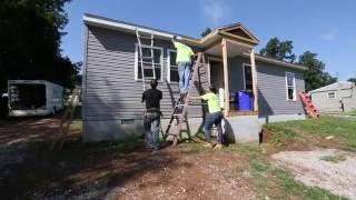 071416 School Police work on Habitat home