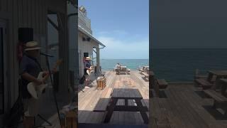 Sitting on the end of Anna Maria Island Pier. Florida 2024