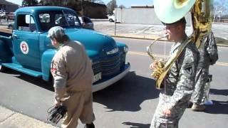 Military Dude follows Fat Guy with a Tuba