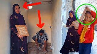 empathy single mother and her daughters in tiling bathroom floor with help of a master