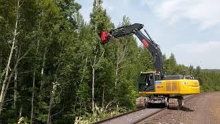 Hi-Rail Excavator with Brush Cutter Attachment