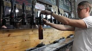 iTap Boel Filling a glass bottle with craft beer