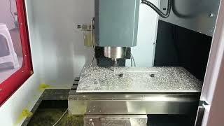 Yornew's MX220 small CNC milling machine for processing aluminum plate tensile specimens