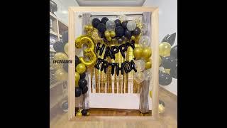 Black and gold balloon decoration.