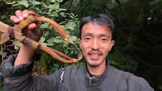 slingshot hunting bird at night. Rural Area Nepal