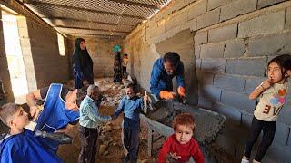 While the children cut their hair for school, Shirvan helps the workers build the house