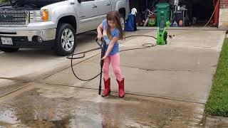 Putting the kiddos to work pressure washing the driveway