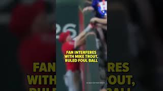 The fan appears to have grabbed the ball out of Trout’s glove #shorts
