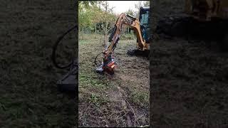 Klou KSG1-EX stump grinder in action on 2t CAT excavator.