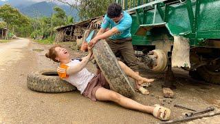 Tractor repair girl changes tire behind success