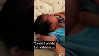 The child held the hair with his hand | The baby is crying by pulling the hair.#shorts