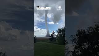 Tornado Swirls Over Field in Alberta, Canada