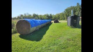 Trying to get things done. Cows delayed. Round bales covered.  Building the stanchion room.