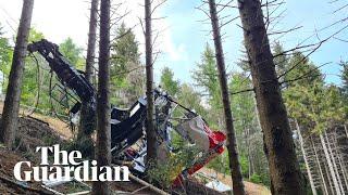 Italian investigators assess wrecked cable car that crashed to ground