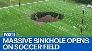 Video captures moment sinkhole opens on soccer field