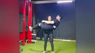 Girlfriend cradle carry her boyfriend on gym | girl friend lift carry her boy friend