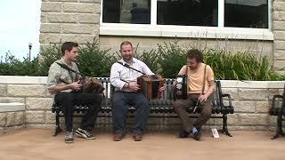 Members of Beoga performing at Floyd's Bench in Downtown Muskegon