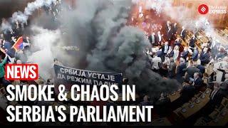 Watch I Serbian Parliament Erupts in Chaos as Opposition Throws Smoke Grenades