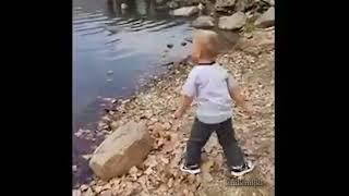 boy throws skipping rock