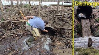 Unclogging And Sending Log Through Old Iron Culvert