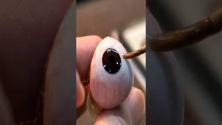 The process of making and wearing artificial eyes that are more realistic than real eyes.