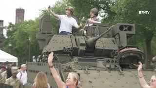 DC Military Parade Attendees Pose with Weapons and Tanks