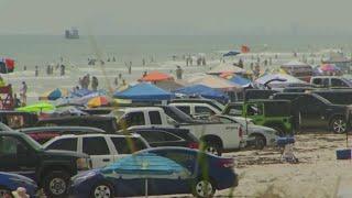 Large crowds gather on beaches for holiday weekend