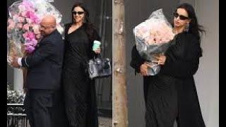 Irina Shayk carries a massive bouquet of pink roses on her 39th birthday while out celebrating