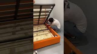 Orange storage box bed.A woman install a bed is not so easy, only ask the master to install