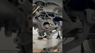 Using a rubber mallet to free up the axle to remove the rear wheel bearing. #wheelbearing #subaru