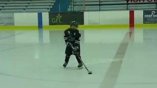 5 yr old Hockey improving on scooping the puck