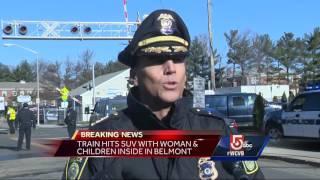 Woman injured when car struck by train