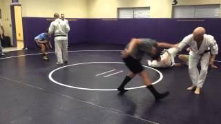 Royce Gracie and students roll with high school wrestlers