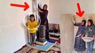 empathy of a single mother and her daughters in installing an oil heater and plastering bathroom