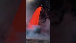 Lava cascading into ocean