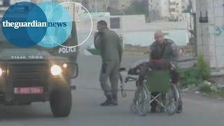 Israeli policeman pushes Palestinian out of wheelchair