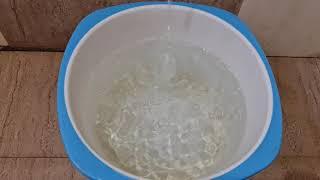 Mesmerizing Water Flow: Filling a Bucket with Tap Water