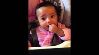 Ella Ruth dancing in the highchair