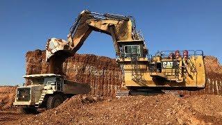 Caterpillar 6040 Excavator Loading Terex Dumpers And Operator View