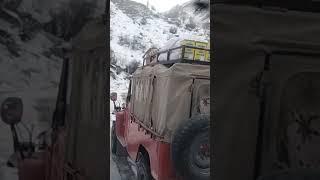 "Hard Work on the Edge: Jeep Driver vs. Dangerous Mountain Road"