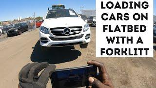 Loading cars onto a Flatbed with forklifts |  Auto Transport Car Hauling Business